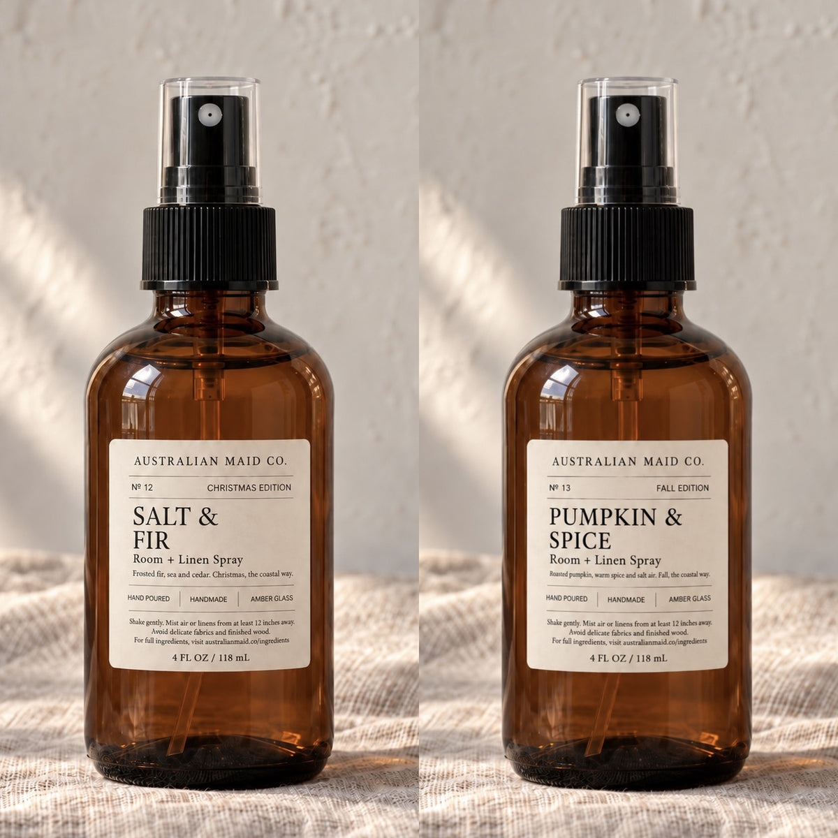 Salt & Fir and Pumpkin & Spice room and linen sprays side by side in amber glass bottles